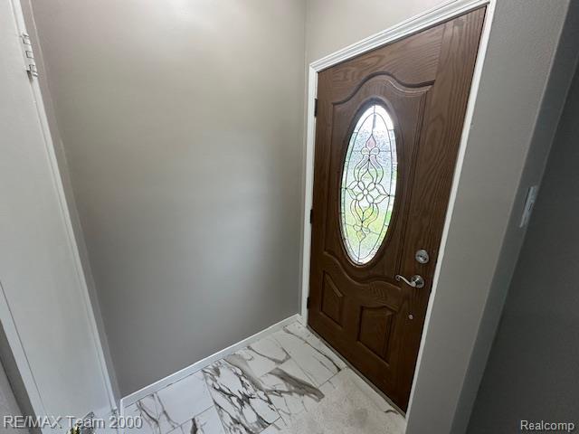 1042 Drexel St, Dearborn, MI 48128 - foyer entrance with light marble finish floors and baseboards