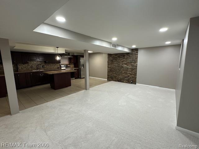 1042 Drexel St, Dearborn, MI 48128 - finished basement featuring light colored carpet, baseboards, and recessed lighting