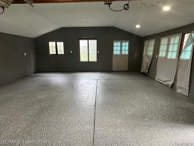 1042 Drexel St, Dearborn, MI 48128 - unfurnished room with vaulted ceiling, healthy amount of natural light, recessed lighting, and speckle patterned floor