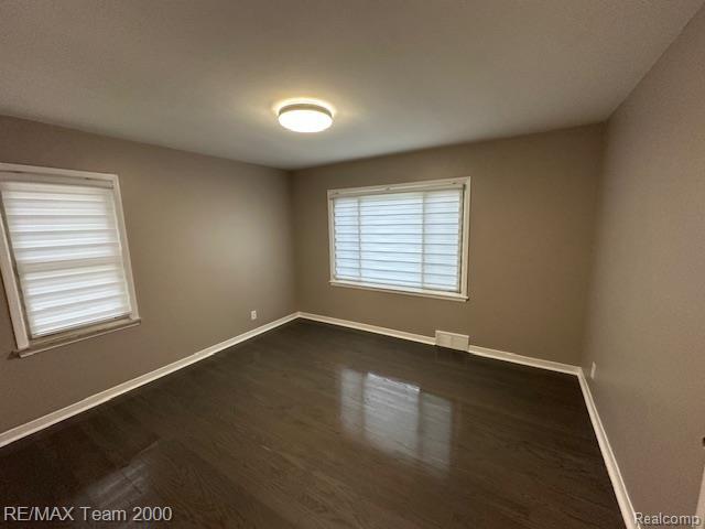 1042 Drexel St, Dearborn, MI 48128 - unfurnished room featuring baseboards and dark wood finished floors