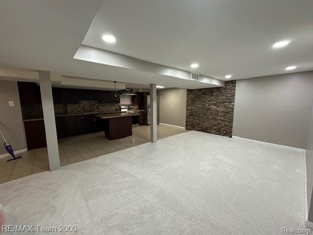 1042 Drexel St, Dearborn, MI 48128 - finished basement with light colored carpet, baseboards, recessed lighting, and light tile patterned floors