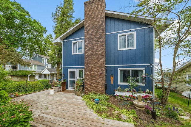 21922 Lake St, Cassopolis, MI 49031 - back of house featuring a chimney and a deck