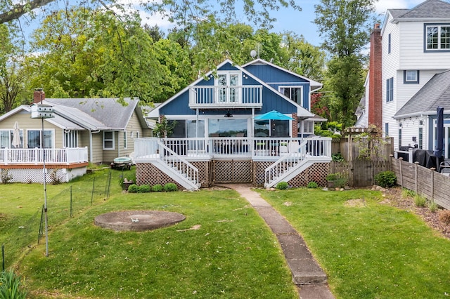 21922 Lake St, Cassopolis, MI 49031 - back of property with stairway, a wooden deck, and board and batten siding