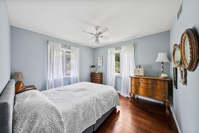 21922 Lake St, Cassopolis, MI 49031 - bedroom with multiple windows, dark wood finished floors, baseboards, and ceiling fan