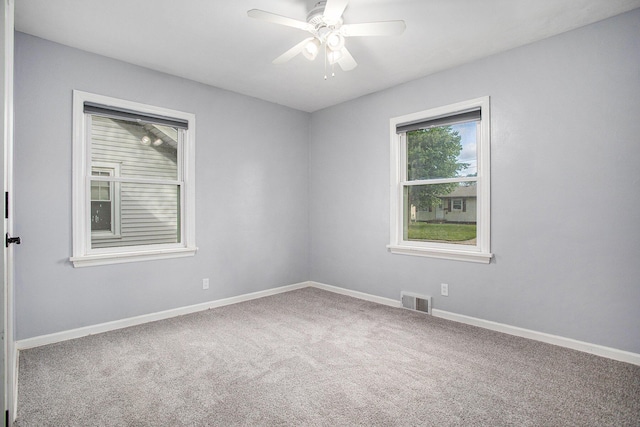 515 Fairfield Ave, Battle Creek, MI 49015 - empty room featuring carpet flooring, a ceiling fan, and baseboards