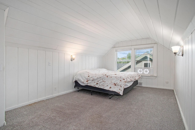 515 Fairfield Ave, Battle Creek, MI 49015 - bedroom with carpet, vaulted ceiling, and wood walls