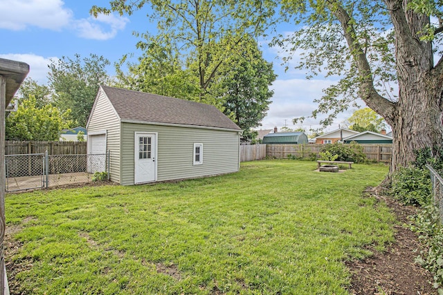 515 Fairfield Ave, Battle Creek, MI 49015 - view of yard with a fire pit, an outbuilding, and a detached garage