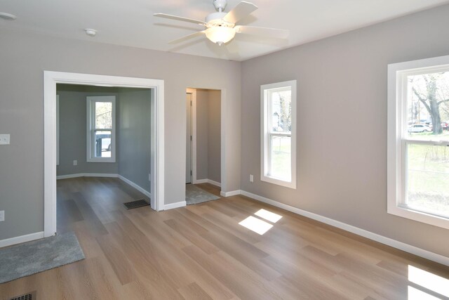 925 Princeton Ave, Kalamazoo, MI 49007 - unfurnished room featuring light wood-style flooring, healthy amount of natural light, and ceiling fan