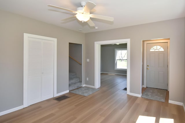 925 Princeton Ave, Kalamazoo, MI 49007 - entrance foyer with light wood-style flooring, stairway, ceiling fan, and baseboards