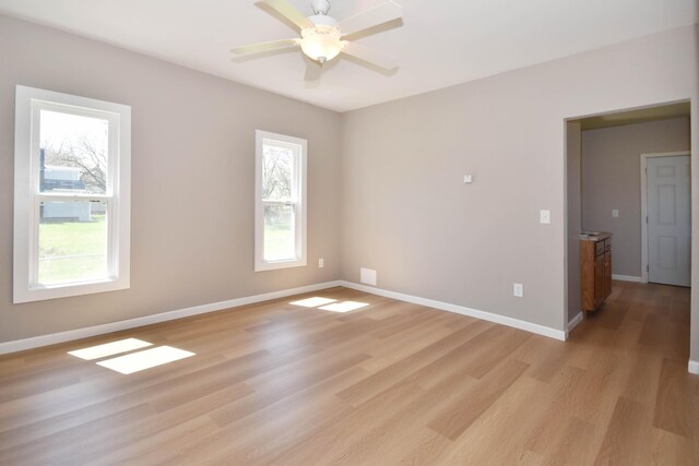 925 Princeton Ave, Kalamazoo, MI 49007 - spare room with healthy amount of natural light, light wood finished floors, and baseboards