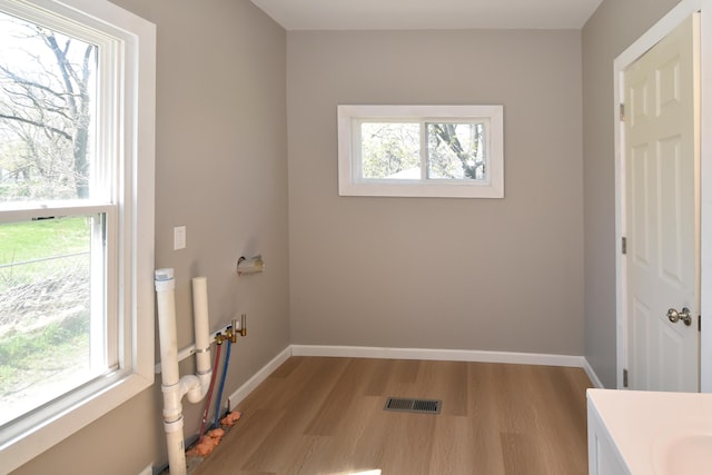 925 Princeton Ave, Kalamazoo, MI 49007 - laundry room featuring light wood-type flooring and baseboards