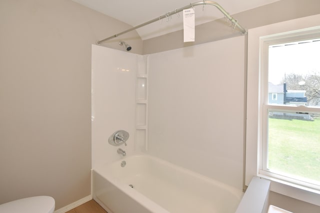 925 Princeton Ave, Kalamazoo, MI 49007 - bathroom featuring shower / bathtub combination, toilet, and baseboards