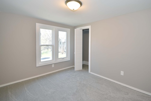 925 Princeton Ave, Kalamazoo, MI 49007 - unfurnished bedroom with carpet flooring, baseboards, and a closet
