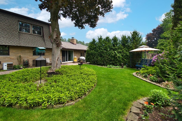 2727 S Lakeshore Dr Unit F-24, Saint Joseph, MI 49085 - view of grassy yard with central AC