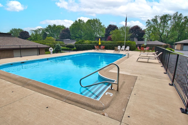 2727 S Lakeshore Dr Unit F-24, Saint Joseph, MI 49085 - community pool with a patio and view of scattered trees