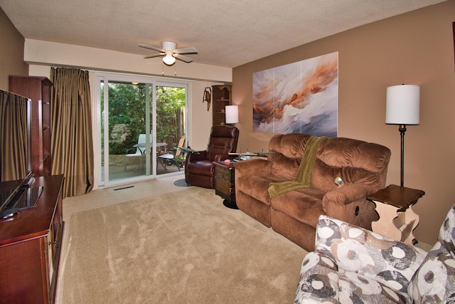 2727 S Lakeshore Dr Unit F-24, Saint Joseph, MI 49085 - carpeted living area featuring ceiling fan and a textured ceiling