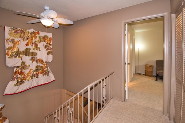 2727 S Lakeshore Dr Unit F-24, Saint Joseph, MI 49085 - hallway with an upstairs landing and light colored carpet