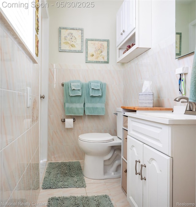 33532 Regal, Fraser, MI 48026 - bathroom featuring tile walls, toilet, vanity, and tile patterned floors