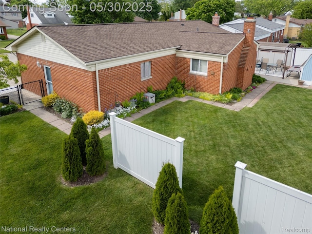 33532 Regal, Fraser, MI 48026 - view of property exterior featuring a gate, brick siding, roof with shingles, and a chimney