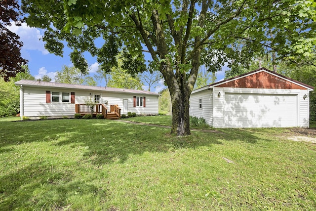 1862 19 Mile Rd, Barryton, MI 49305 - rear view of property featuring a garage, a yard, and a wooden deck