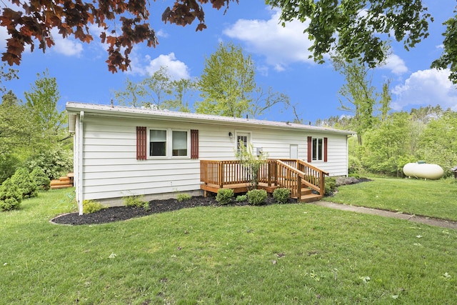 1862 19 Mile Rd, Barryton, MI 49305 - view of front facade featuring a deck and a front yard