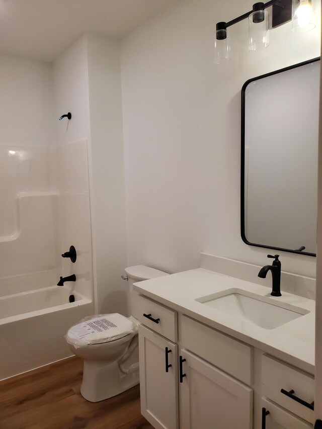3995 112th Ave, Allegan, MI 49010 - full bathroom with vanity, wood finished floors, and shower / washtub combination
