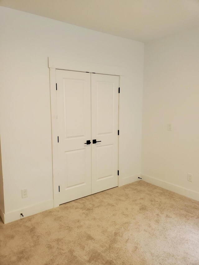 3995 112th Ave, Allegan, MI 49010 - unfurnished bedroom featuring carpet floors and a closet