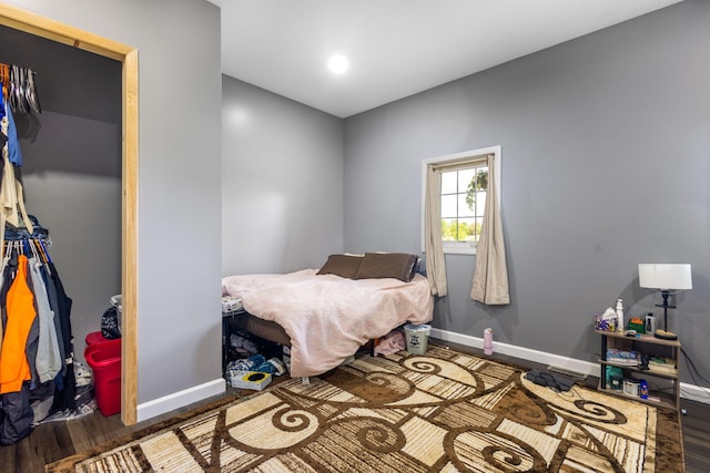 17495 Bison Trl, White Pigeon, MI 49099 - bedroom with wood finished floors, baseboards, and a closet