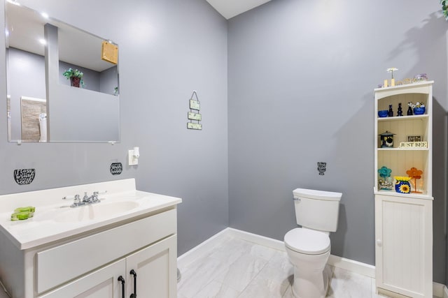17495 Bison Trl, White Pigeon, MI 49099 - bathroom featuring marble finish flooring, baseboards, toilet, and vanity
