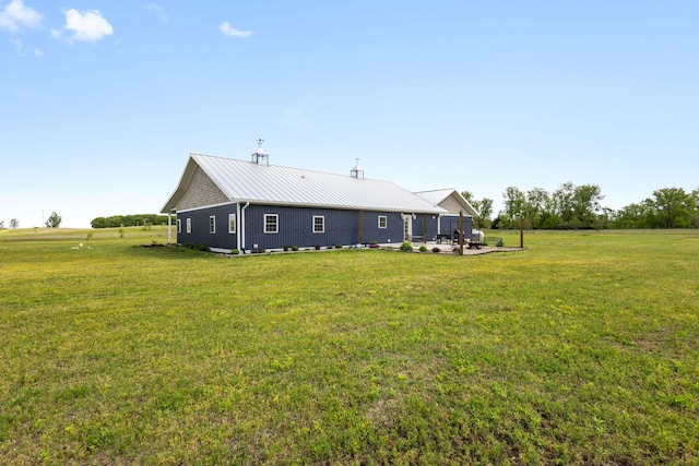 17495 Bison Trl, White Pigeon, MI 49099 - rear view of house with a lawn and metal roof