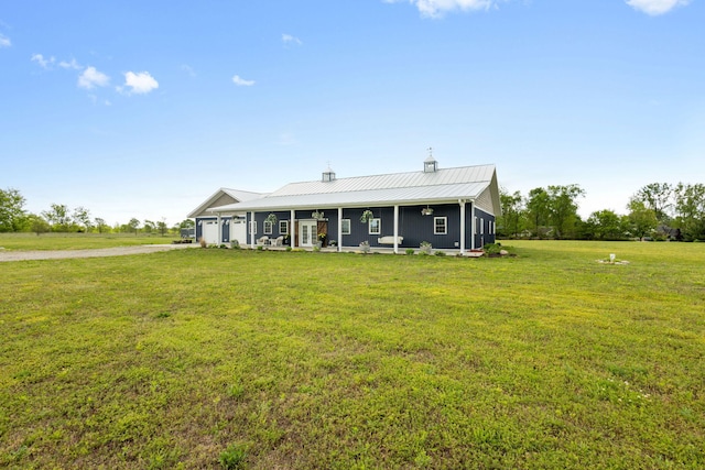 17495 Bison Trl, White Pigeon, MI 49099 - farmhouse-style home featuring a garage, a front lawn, metal roof, driveway, and a chimney