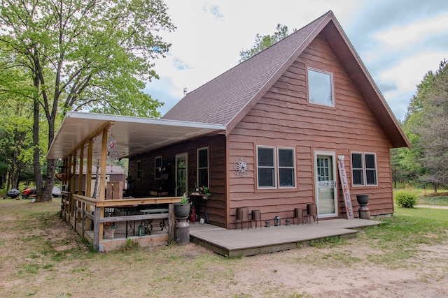 6210 W Monroe Rd, Hesperia, MI 49421 - rear view of property featuring a wooden deck and a shingled roof