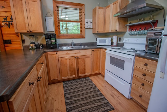 6210 W Monroe Rd, Hesperia, MI 49421 - kitchen featuring white appliances, a sink, wall chimney exhaust hood, light wood-type flooring, and dark countertops