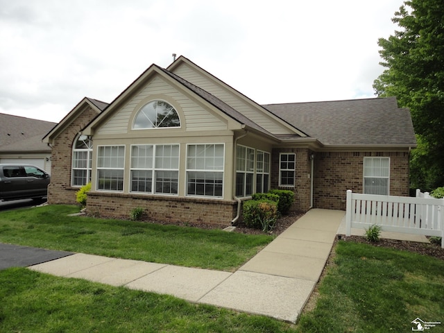 36111 Traditions Dr, Westland, MI 48185 - ranch-style home featuring brick siding and roof with shingles