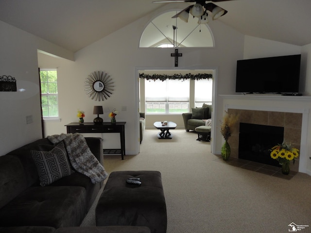 36111 Traditions Dr, Westland, MI 48185 - living room with lofted ceiling, ceiling fan, carpet flooring, and a tiled fireplace