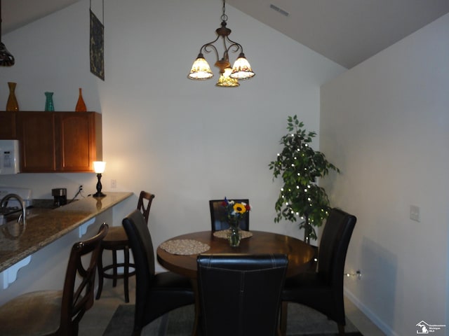 36111 Traditions Dr, Westland, MI 48185 - dining room with vaulted ceiling and a chandelier