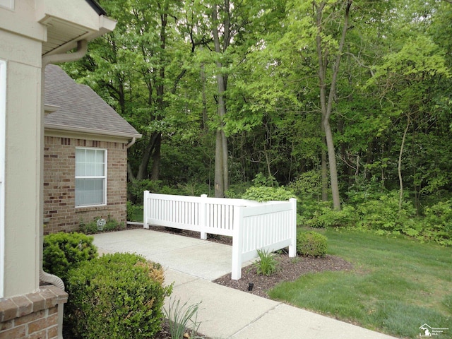 36111 Traditions Dr, Westland, MI 48185 - view of patio / terrace featuring a view of trees