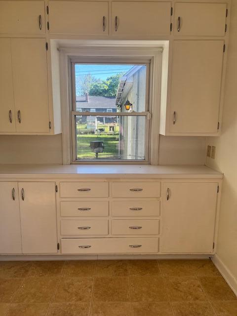 337 E Pine St, Fremont, MI 49412 - kitchen with light countertops and white cabinetry