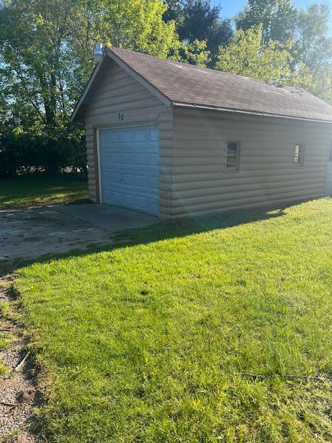52 N Webster St, White Cloud, MI 49349 - detached garage featuring driveway