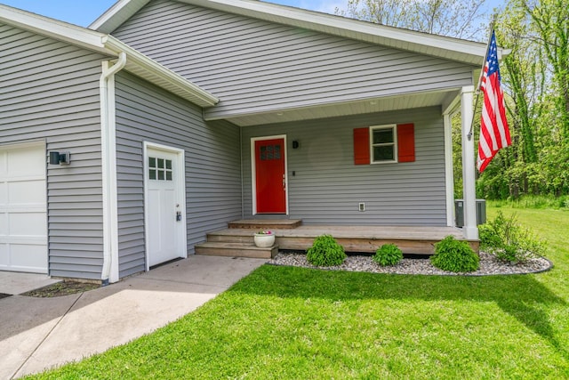 124 S Shore Dr, Portage, MI 49002 - view of front of property featuring a front lawn, a porch, central AC unit, and a garage
