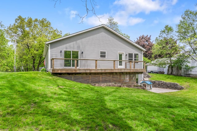 124 S Shore Dr, Portage, MI 49002 - back of property featuring a wooden deck and a lawn
