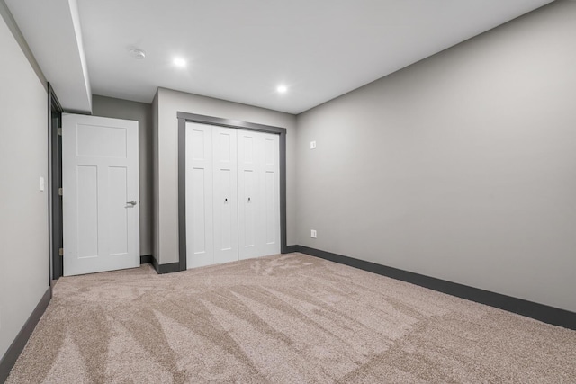 124 S Shore Dr, Portage, MI 49002 - unfurnished bedroom featuring carpet, baseboards, a closet, and recessed lighting