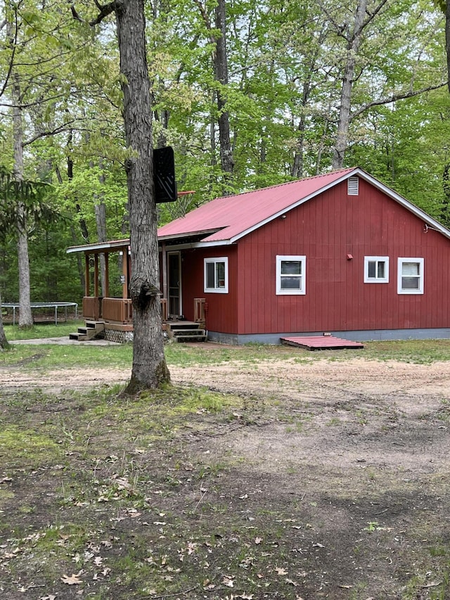 8953 18th Ave, Bitely, MI 49309 - view of front of home featuring metal roof