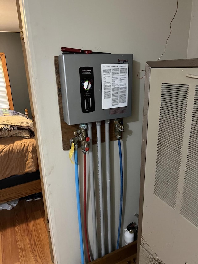8953 18th Ave, Bitely, MI 49309 - utilities with tankless water heater and a heating unit