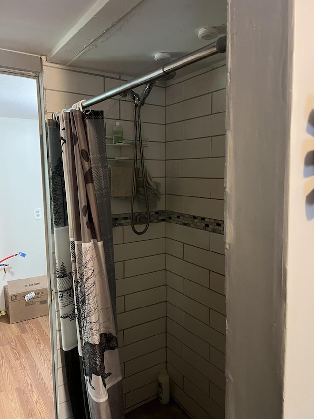 8953 18th Ave, Bitely, MI 49309 - bathroom with tiled shower and wood finished floors