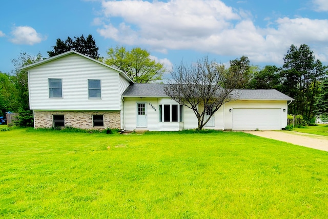 12641 Patricia Ave, Grant, MI 49327 - view of front facade with entry steps, driveway, a front lawn, and an attached garage
