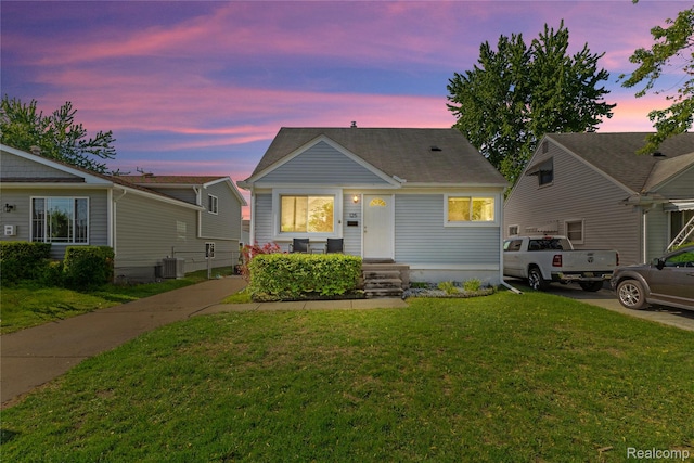 125 Tecumseh St, Clawson, MI 48017 - bungalow-style home featuring central air condition unit and a yard