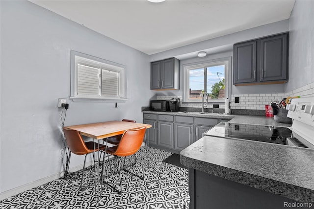 125 Tecumseh St, Clawson, MI 48017 - kitchen with a sink, gray cabinetry, baseboards, and range with electric cooktop