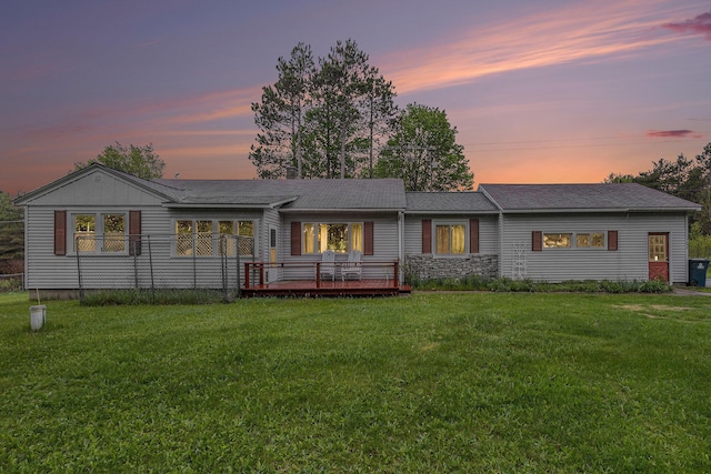 7694 Norconk Rd, Bear Lake, MI 49614 - back of house with a lawn and a wooden deck