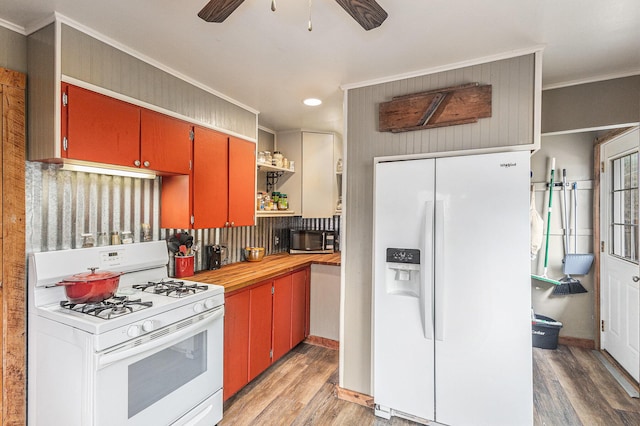 7694 Norconk Rd, Bear Lake, MI 49614 - kitchen with white appliances, light wood finished floors, ceiling fan, ornamental molding, and recessed lighting